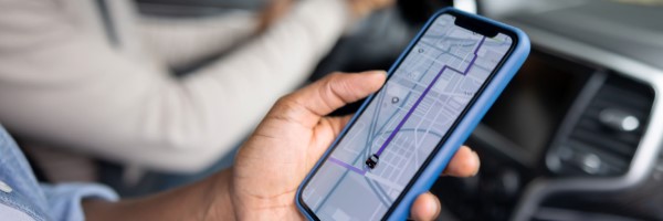 ridesharing app in hand of passenger