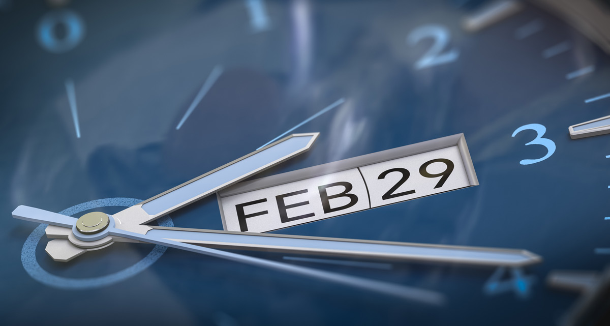  Clock with with calendar date of February 29th written on it. Leap year concept