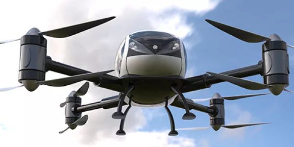 An unmanned passenger drone (air taxi) flying in the sky
