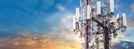 communications tower against colorful sky