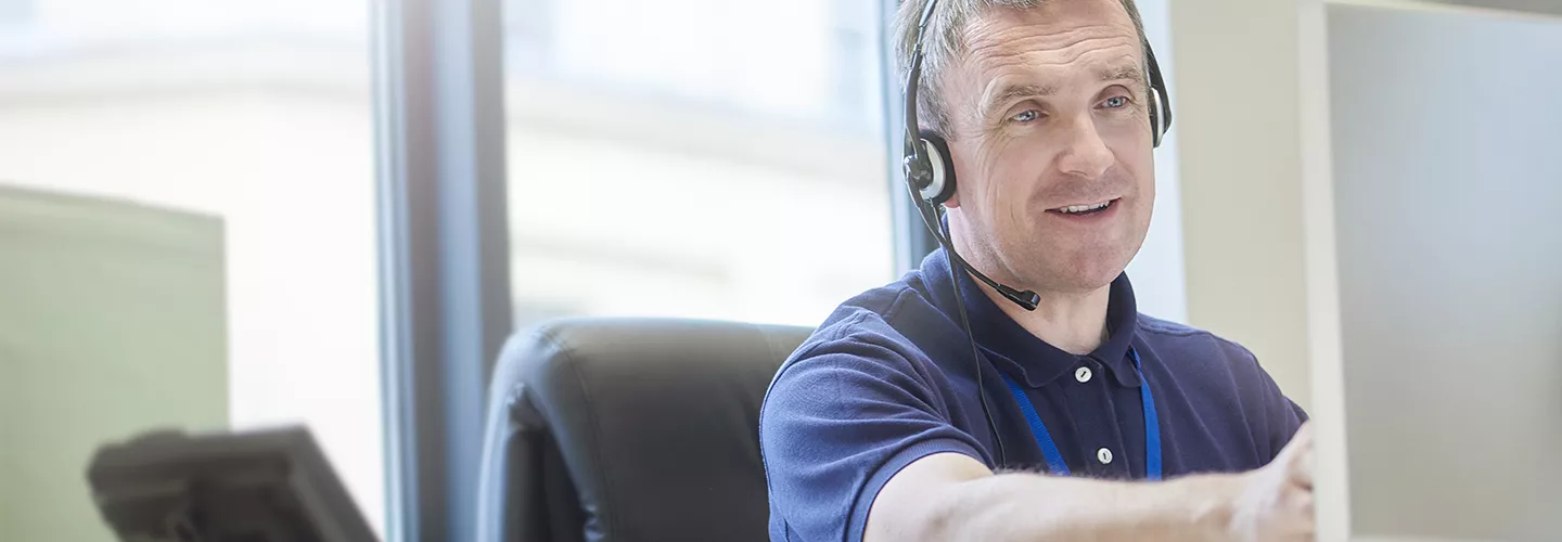 Image: support manager talking via headset