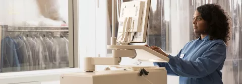 Image: A lady operates equipment for test