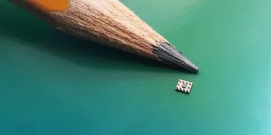 Symphonic™ Mobile Clock Generator SiT30100 shown next to a pencil lead to highlight its small size