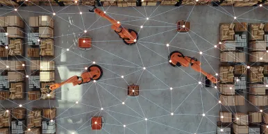 High Angle View Of Smart Warehouse With Robotic Arms and AVs
