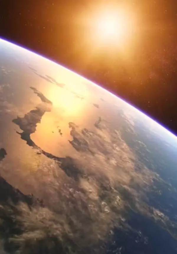 Earth from space with sun in distance